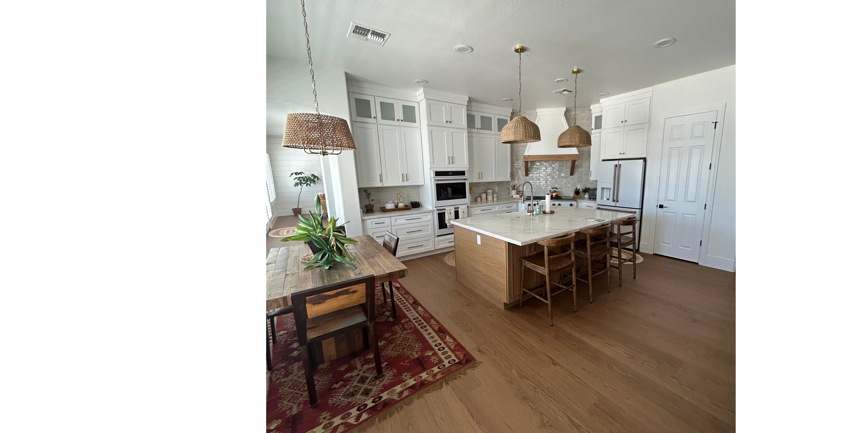 Wood floors in a kitchen and dining area with an area rug