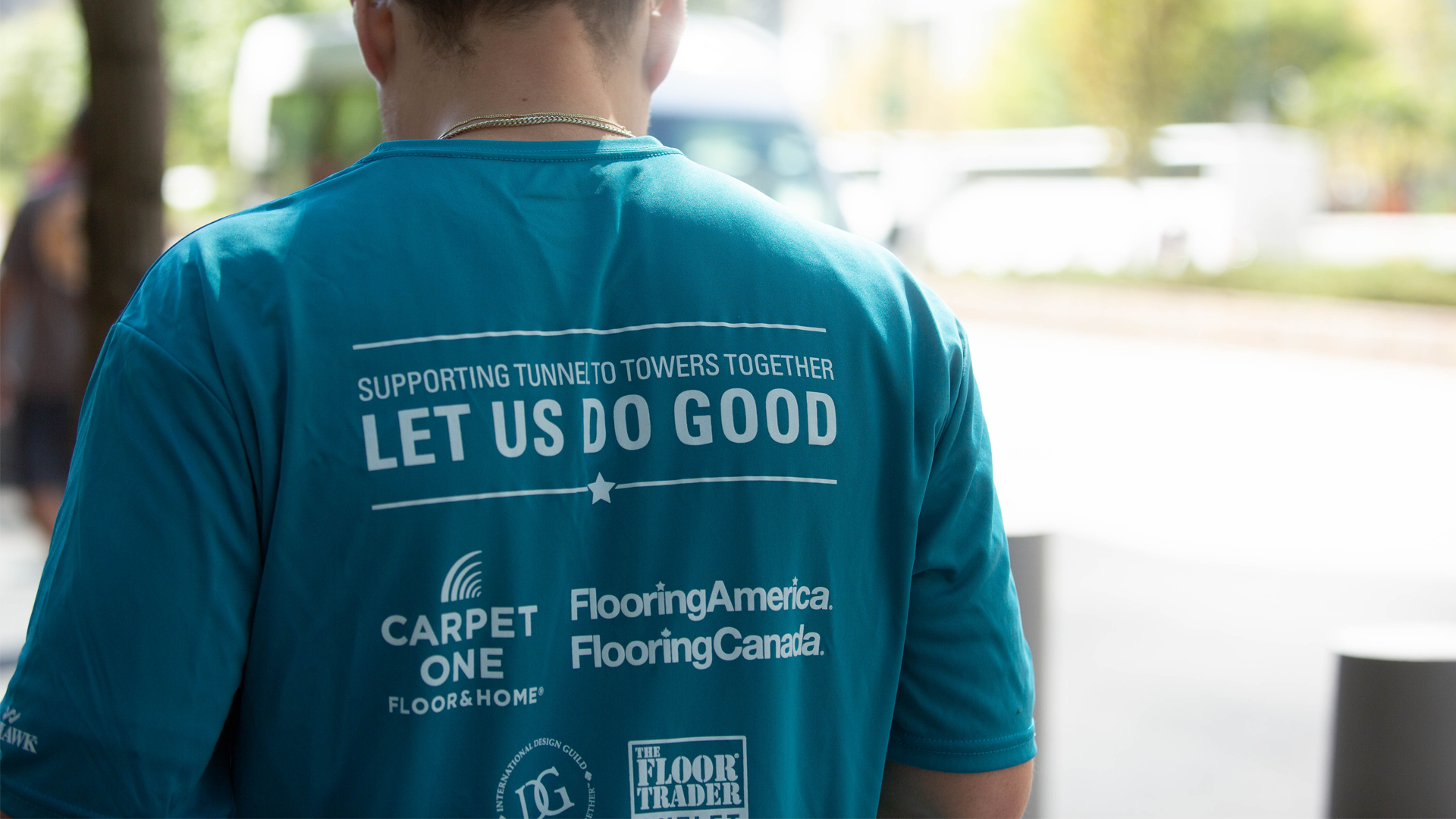 Team member wearing a Let Us Do Good shirt supporting the Tunnel to Towers Foundation