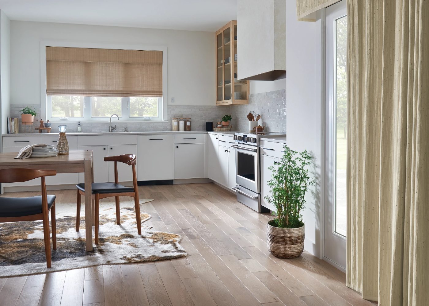Graber natural Roman shades with motorized lift in a kitchen