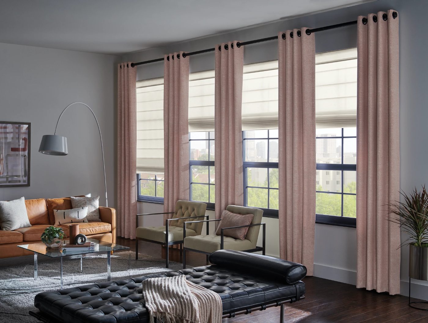 Graber Fresco Roman shades with motorized lift in a living room