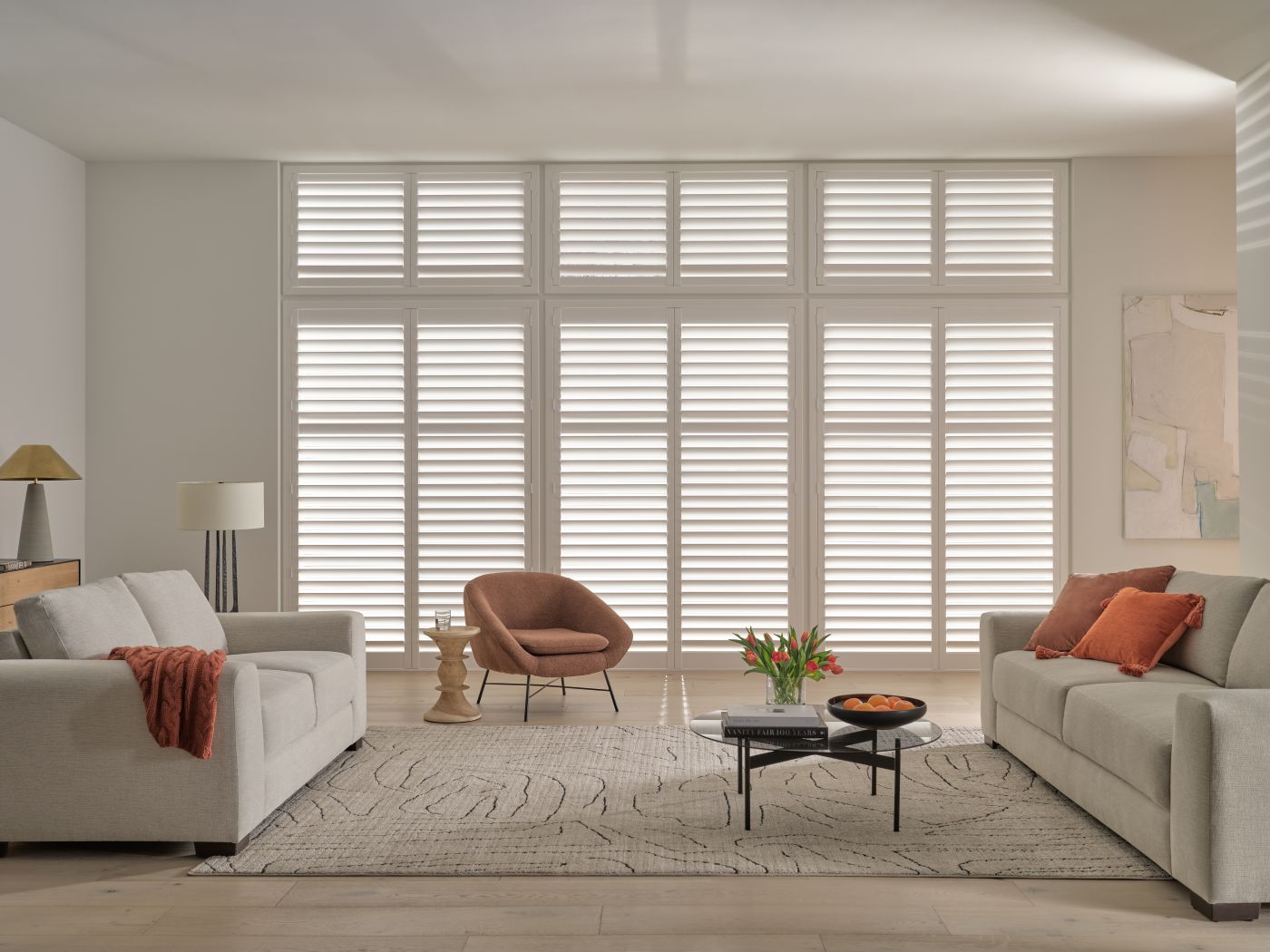 Hunter Douglas Palm Beach polysatin shutters in a living room