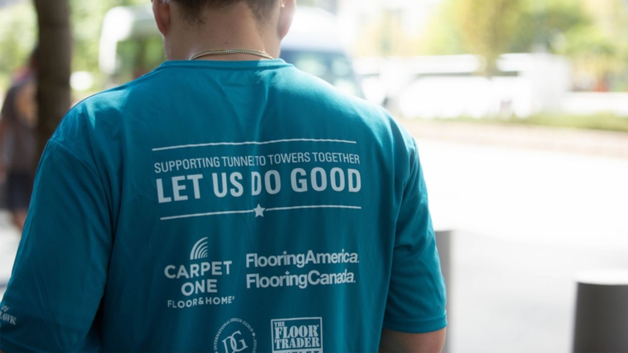 Team member wearing a Let Us Do Good shirt supporting the Tunnel to Towers Foundation