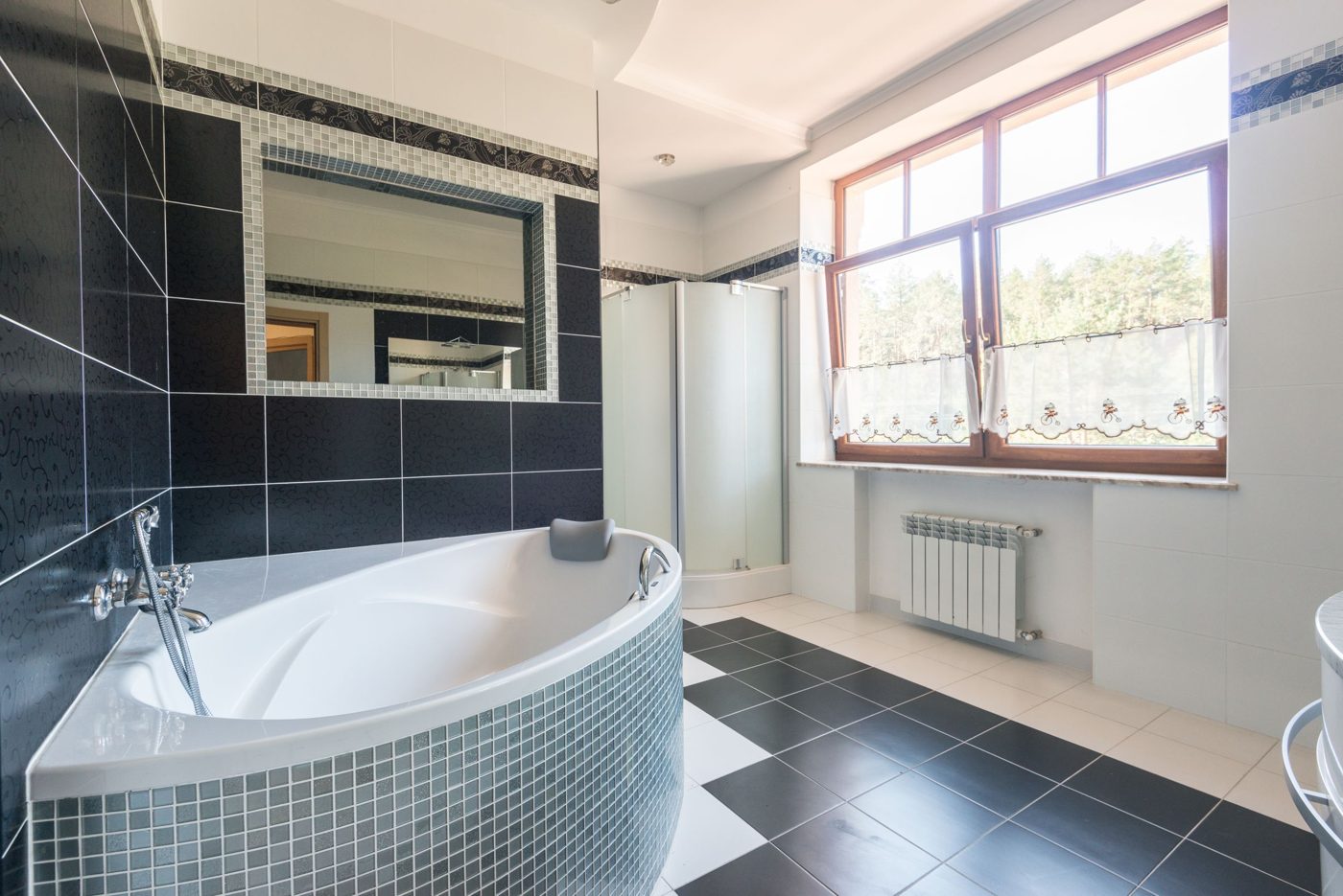 Bathroom with tile floors and a soaking tub