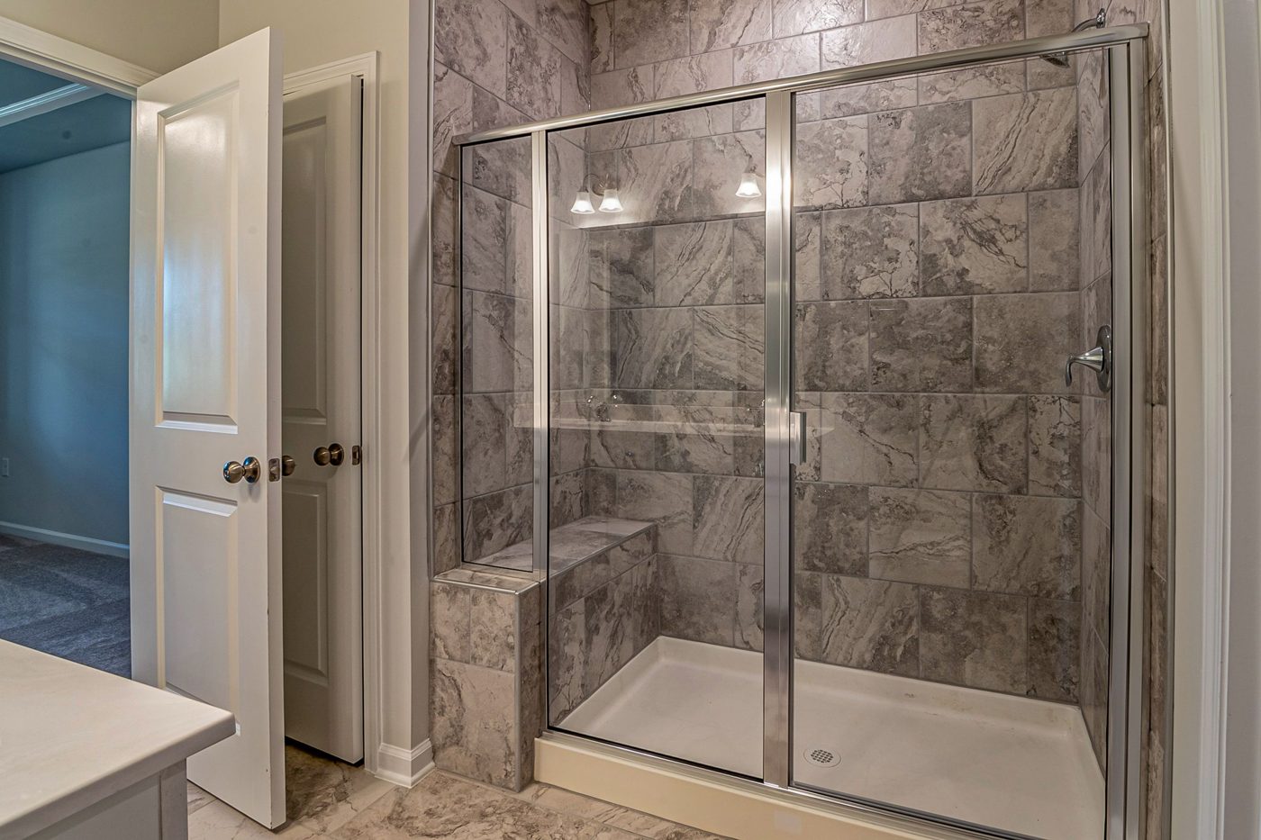 Marble-look tile in a walk-in shower