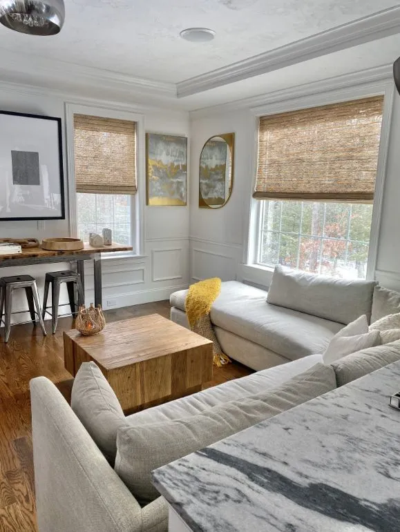 Natural woven shades in a bright living room