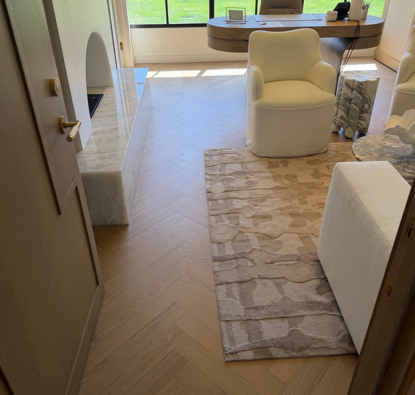 Herringbone wood-look luxury vinyl plank in a living room