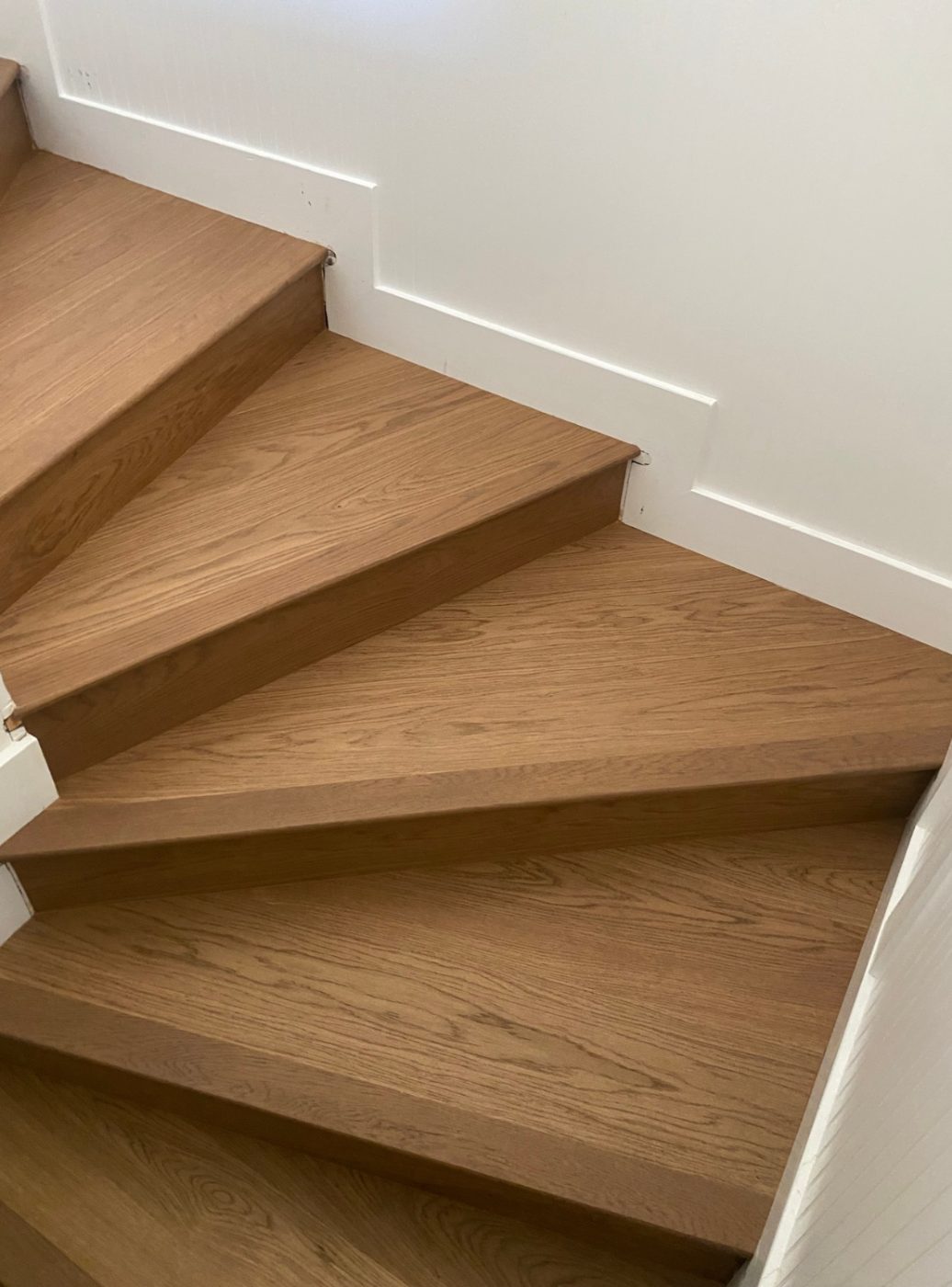 Wood-look luxury vinyl stair treads on a staircase