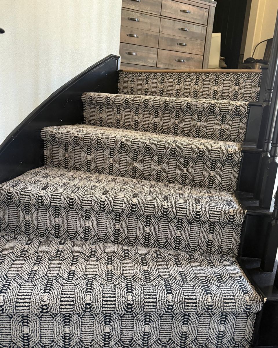 Black-and-cream Karastan Whitemere patterned carpet on stair treads and risers